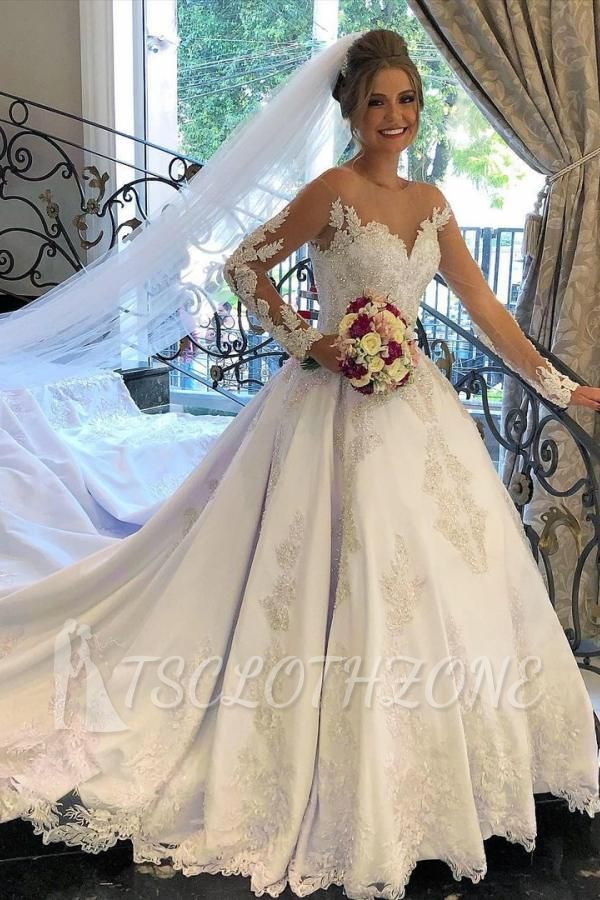 Stilvolles weißes Brautkleid mit langen Ärmeln und Applikationen